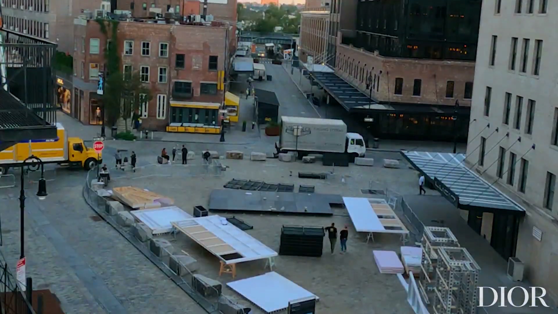 Deliveries staged on Gansevoort Plaza before the Miss Dior Millefiori build